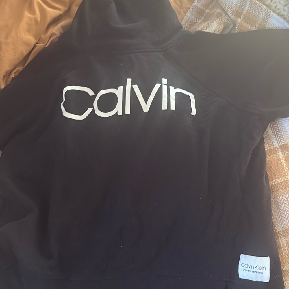 Lighting worn Calvin Klein sweater